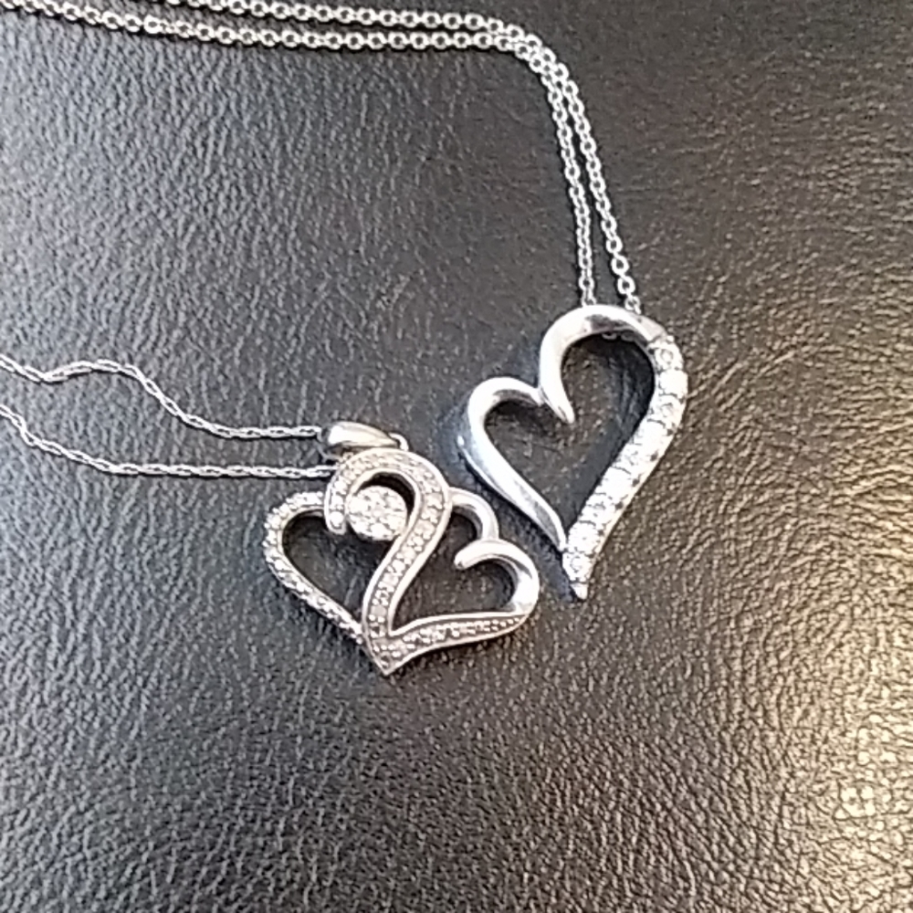 2 very beautiful heart necklaces.